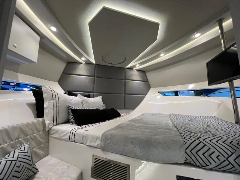 Slide: The Image of Luxurious interior of 2024 Evolve 360HT yacht with modern bedding and ambient lighting. - 18
