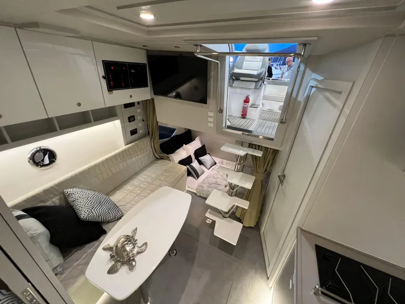 Slide: The Image of Luxurious interior of 2024 Evolve 360HT yacht with modern seating and dining area. - 20