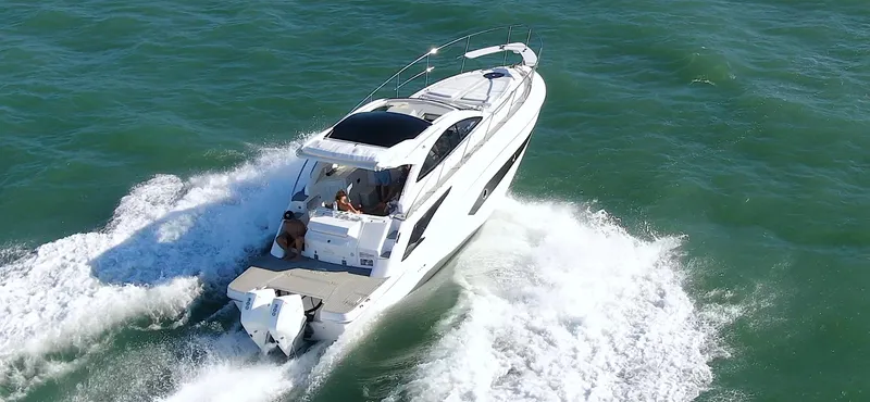 Slide: The Image of 2024 Evolve 360HT boat cruising on open water. - 3