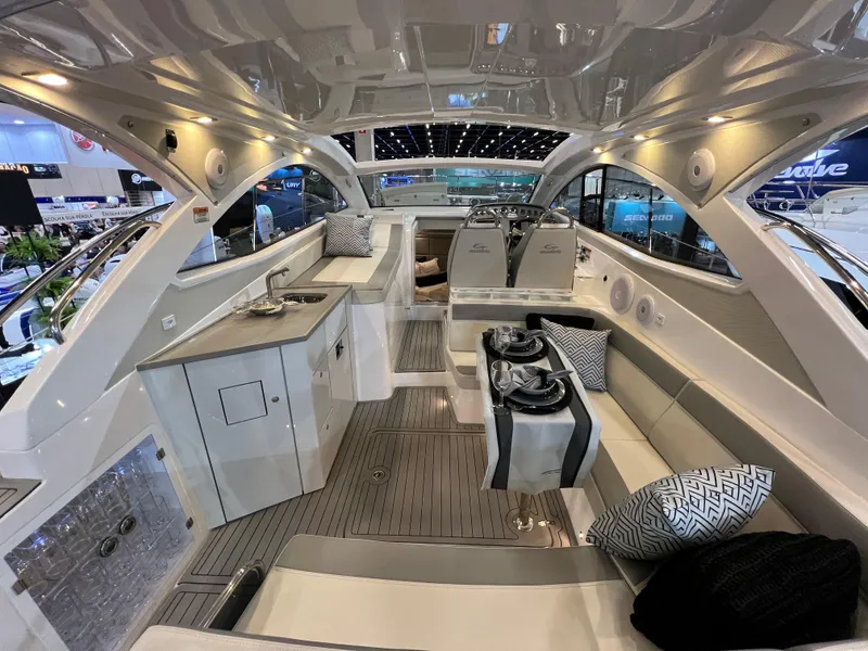 Slide: The Image of Luxurious interior of the 2024 Evolve 360HT yacht with modern amenities and stylish seating. - 8