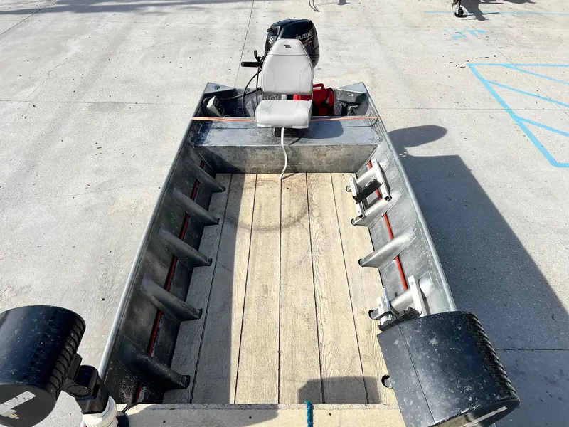 Slide: The Image of 1995 WeldBilt 15 aluminum fishing boat with outboard motor. - 9