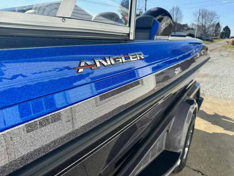 Slide: The Image of 2024 Ranger 1880MS Angler boat in blue and black, close-up side view. - 10