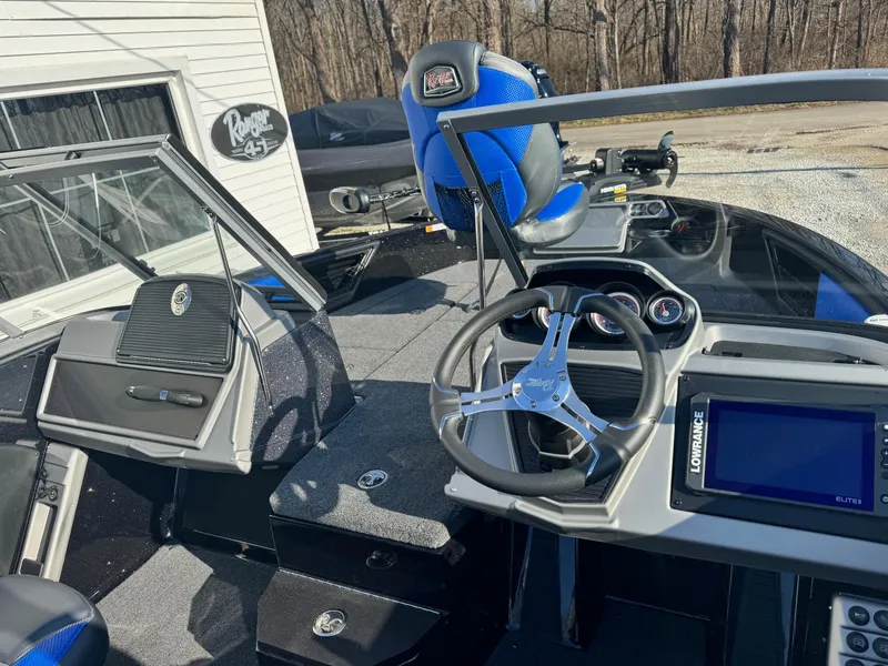 Slide: The Image of 2024 Ranger 1880MS boat interior with steering wheel and navigation system. - 6