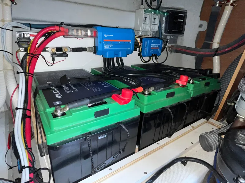 Slide: The Image of Battery compartment of a 2013 Beneteau Swift Trawler 34 with wiring and components. - 16