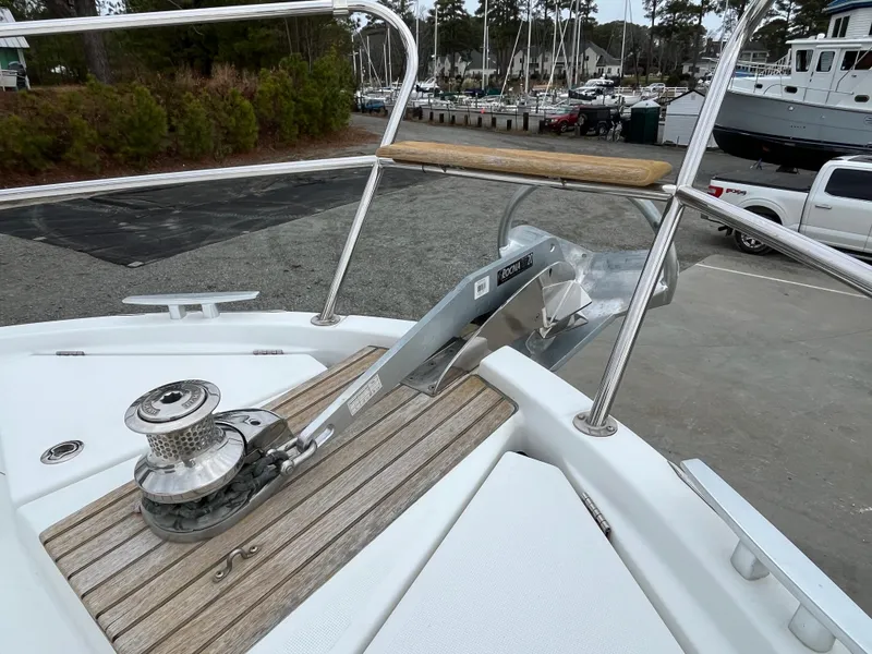 Slide: The Image of 2013 Beneteau Swift Trawler 34 anchor system on deck, marina background. - 27