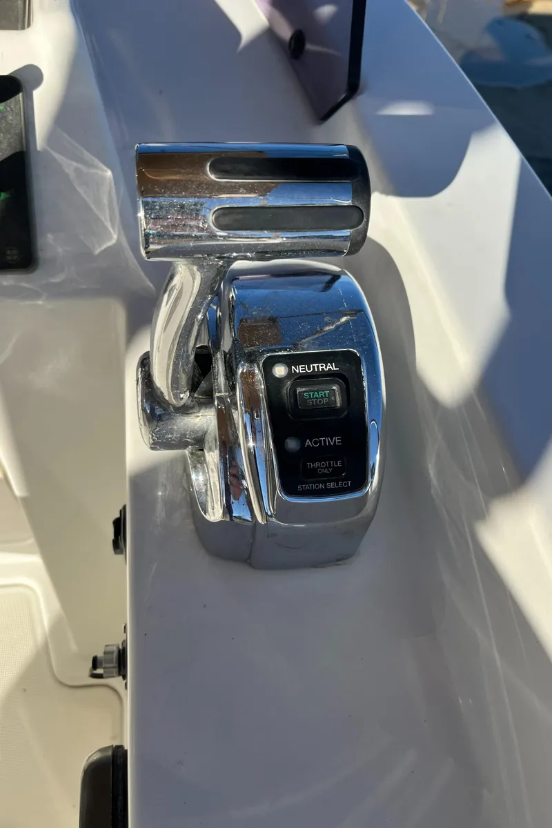 Slide: The Image of Throttle control of 2013 Beneteau Swift Trawler 34 in sunlight. - 41