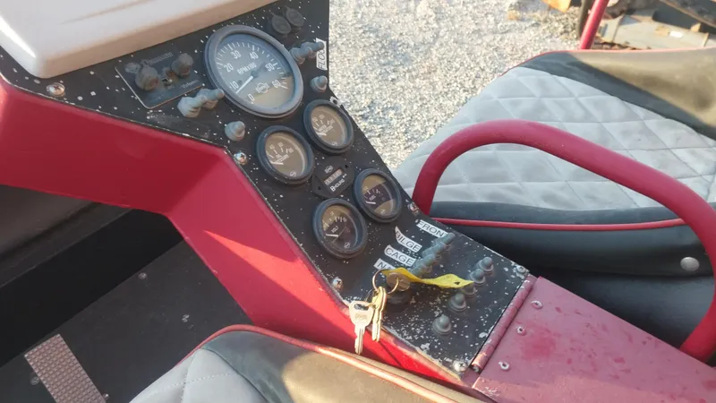 Slide: The Image of Control panel of a 2010 Airboat 18x8 with gauges and ignition keys. - 13