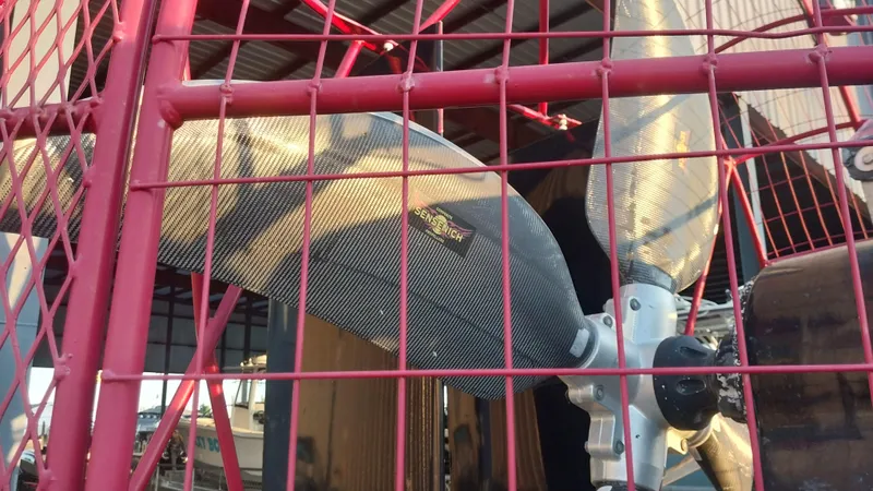 Slide: The Image of Close-up of a 2010 Airboat 18x8 propeller behind a red protective cage. - 6