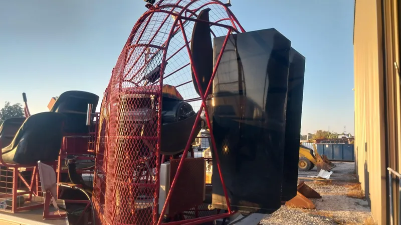 Slide: The Image of 2010 Airboat 18x8 with red protective cage and large propeller. - 7