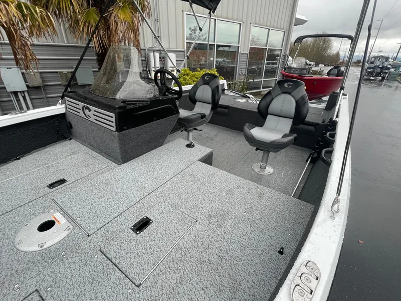 Slide: The Image of 2024 Crestliner 1650 Fish Hawk SC boat interior with seating and steering console. - 11