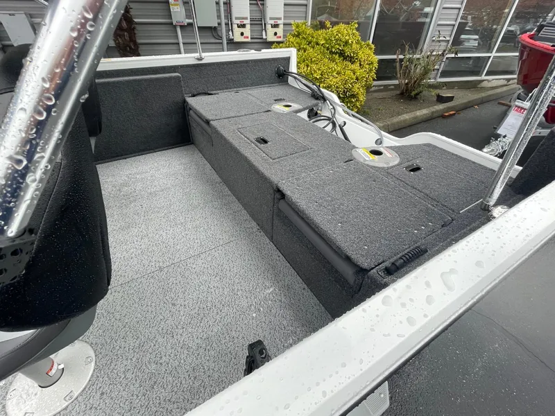 Slide: The Image of 2024 Crestliner 1650 Fish Hawk SC boat interior with storage compartments. - 5