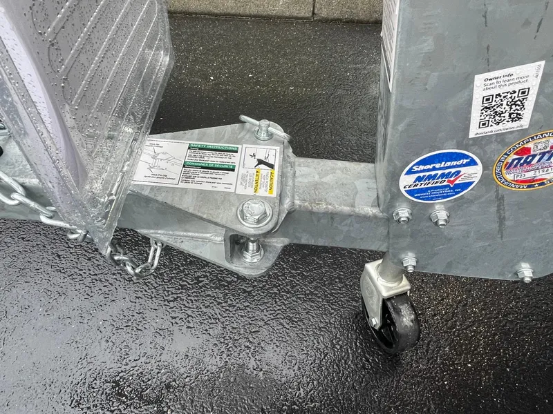 Slide: The Image of Trailer hitch of 2021 Crestliner 1650 Fish Hawk SC on wet pavement. - 14