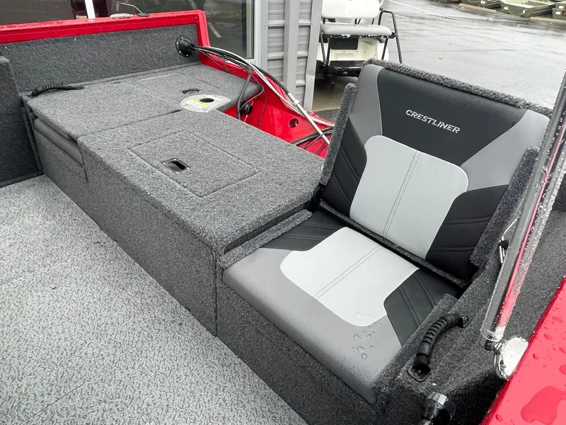 Slide: The Image of 2021 Crestliner 1650 Fish Hawk SC interior with gray seating and storage. - 7