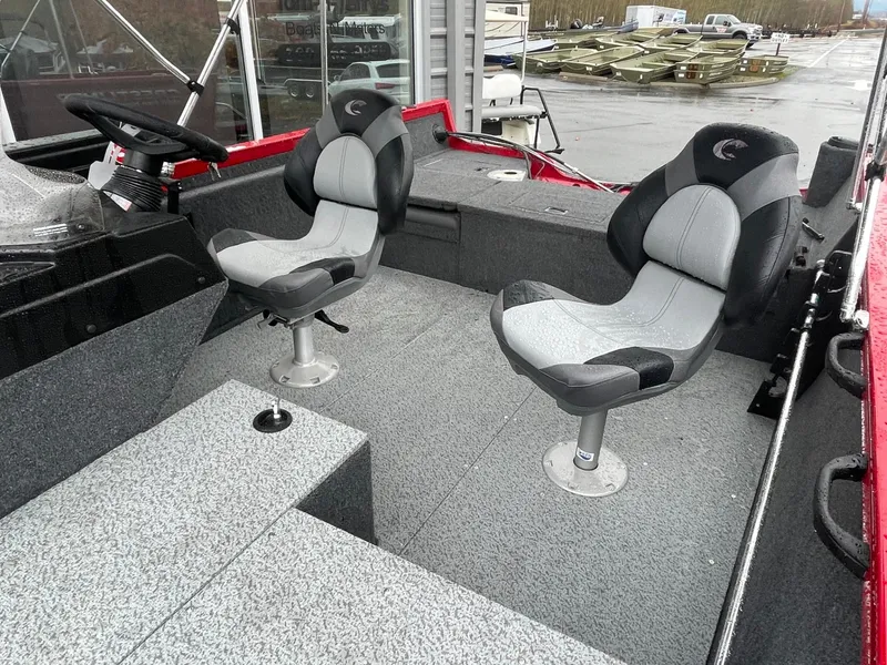 Slide: The Image of 2021 Crestliner 1650 Fish Hawk SC interior with two swivel seats and steering console. - 8