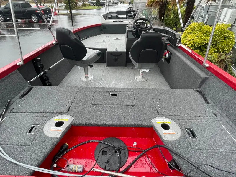 Slide: The Image of 2021 Crestliner 1650 Fish Hawk SC boat interior with seating and storage compartments. - 9