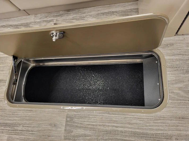 Slide: The Image of Open storage compartment in 2024 Ranger Reata 223C boat. - 6