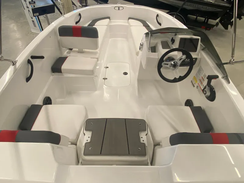Slide: The Image of 2024 Tahoe T16 boat interior with seating and steering wheel. - 4