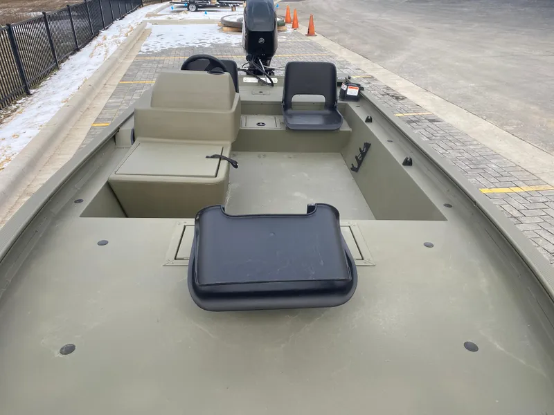 Slide: The Image of 2024 Tracker Grizzly 1754 SC boat interior with seating and storage compartments. - 4