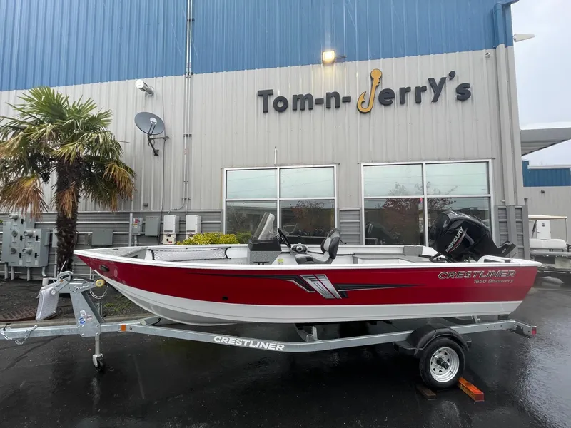 The Image of 2024 Crestliner 1650 Discovery SC boat on trailer at Tom-n-Jerry's dealership. - 1