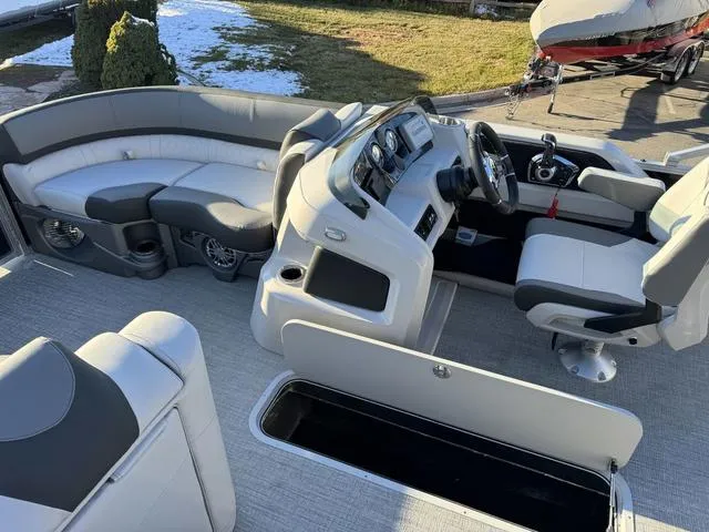 Slide: The Image of 2024 Avalon LSZ Versatile Rear Lounger 23 FT boat interior with modern seating and controls. - 13