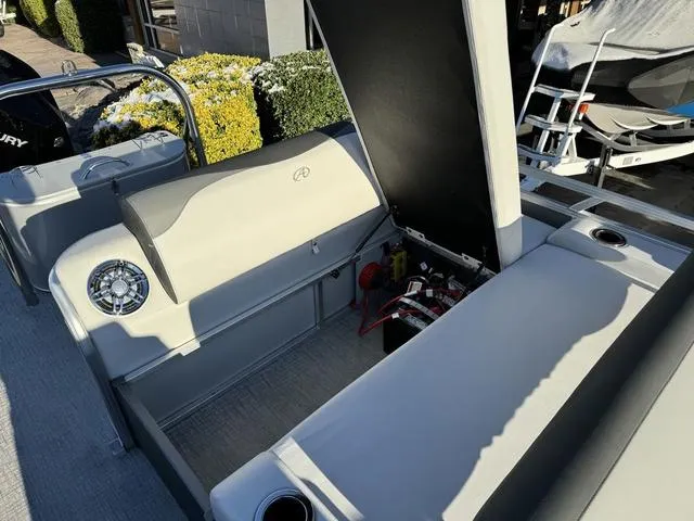 Slide: The Image of 2024 Avalon LSZ Versatile Rear Lounger 23 FT interior with open storage compartment. - 18