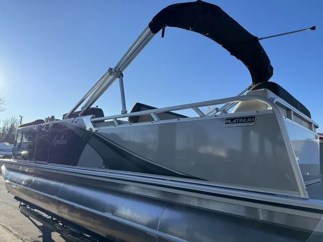 Slide: The Image of 2024 Avalon LSZ Versatile Rear Lounger 23 FT pontoon boat, side view, sunny day. - 5