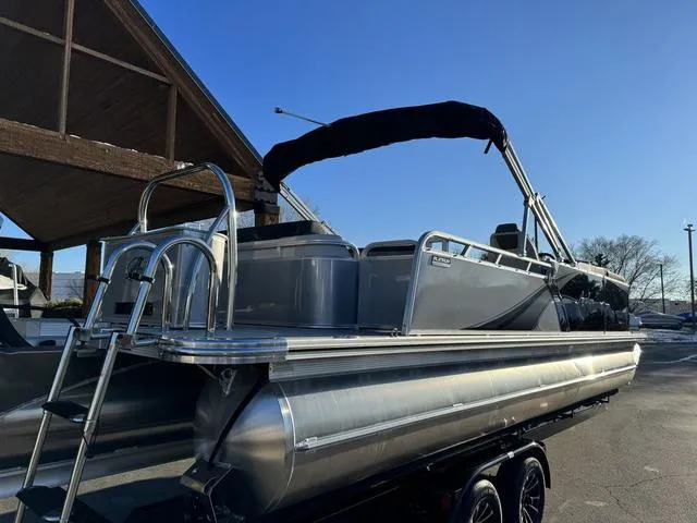 Slide: The Image of 2024 Avalon LSZ Versatile Rear Lounger 23 FT pontoon boat with sleek design and ladder. - 7