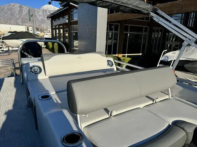 Slide: The Image of 2024 Avalon LSZ Versatile Rear Lounger 23 FT boat with luxurious seating and modern design. - 9