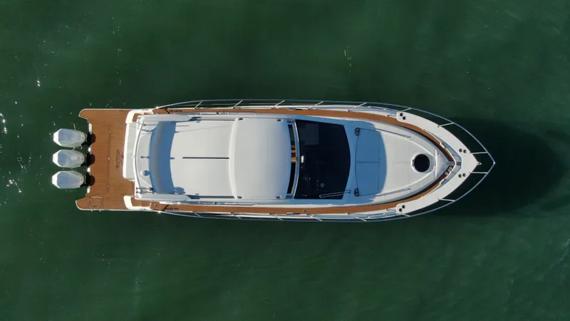 Slide: The Image of Top view of 2024 Evolve 400HT luxury yacht on water. - 10