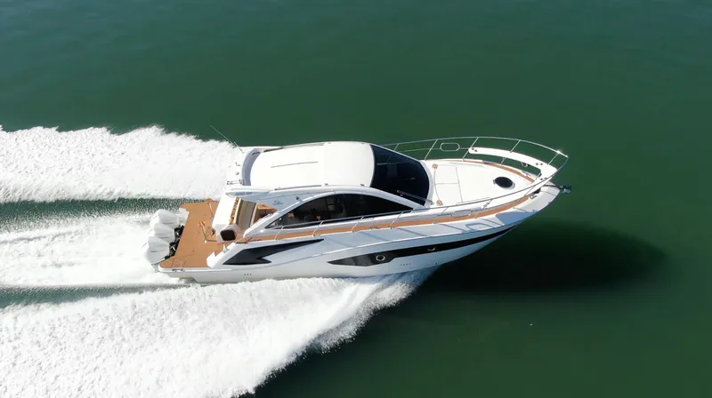Slide: The Image of 2024 Evolve 400HT luxury yacht cruising on open water. - 12