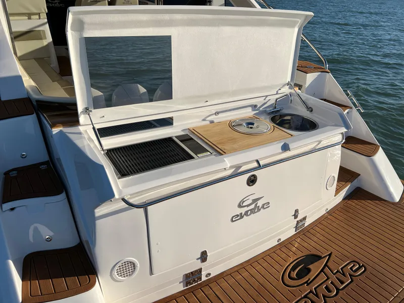 Slide: The Image of Evolve 400HT 2024 yacht with outdoor kitchen and teak deck. - 13
