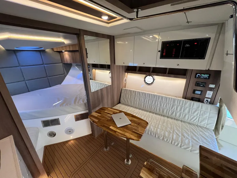 Slide: The Image of Luxurious interior of 2024 Evolve 400HT yacht with modern furnishings and wooden accents. - 21