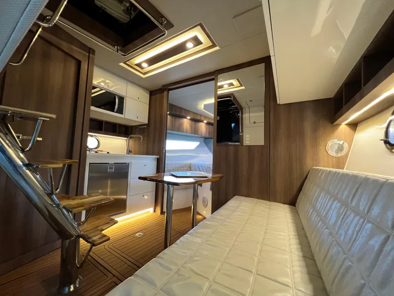 Slide: The Image of Luxurious interior of 2024 Evolve 400HT yacht with modern kitchen and seating area. - 22