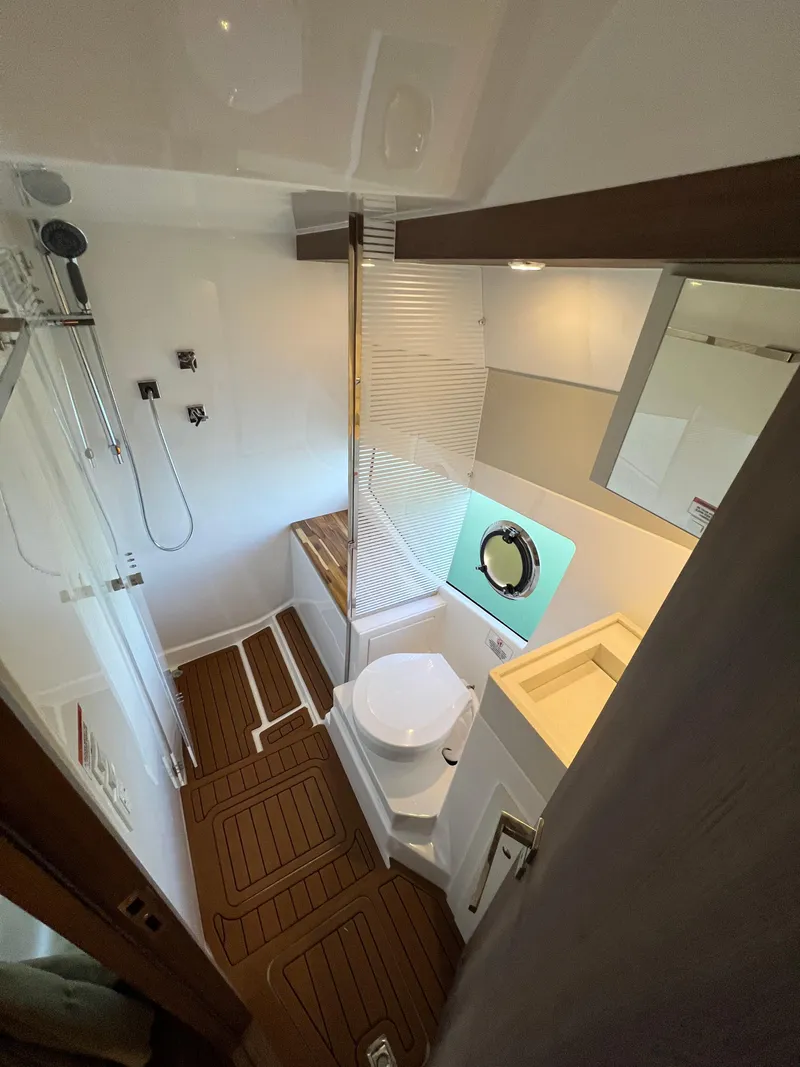 Slide: The Image of Modern bathroom in 2024 Evolve 400HT yacht with wooden flooring and compact design. - 23