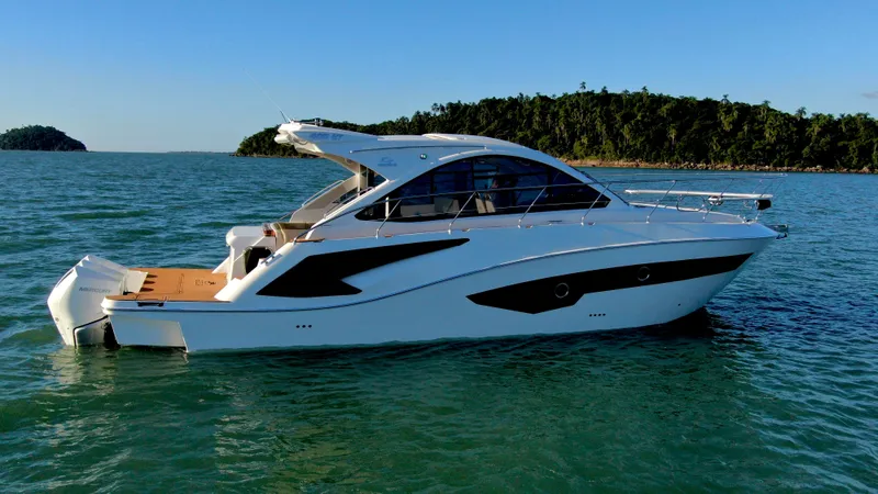 Slide: The Image of 2024 Evolve 400HT luxury yacht cruising on serene waters. - 4