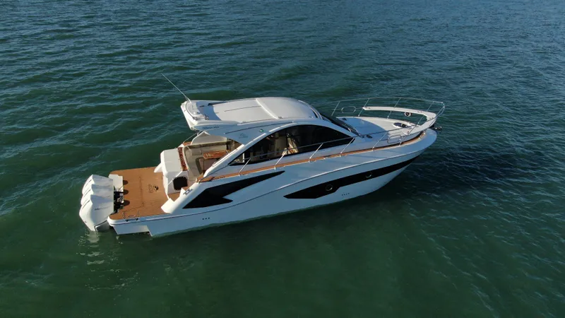 Slide: The Image of 2024 Evolve 400HT luxury yacht cruising on open water. - 6