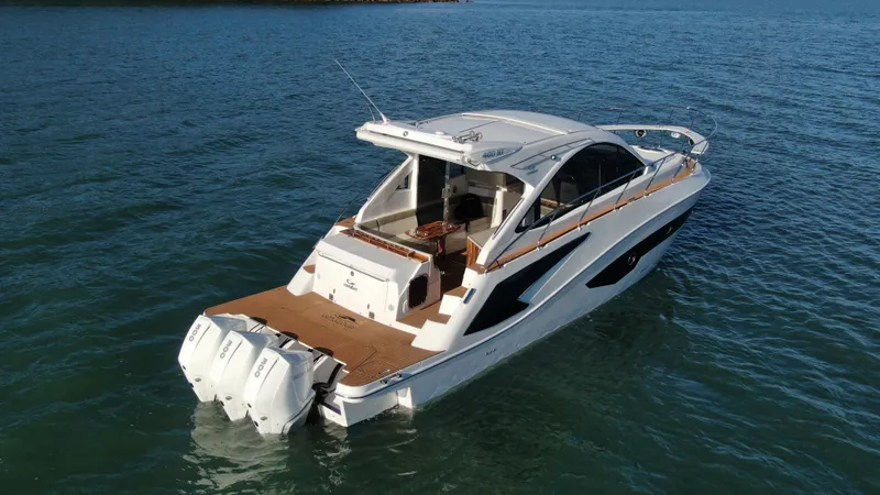 Slide: The Image of 2024 Evolve 400HT luxury motor yacht on open water. - 7