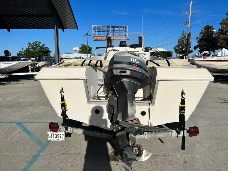 Slide: The Image of 1993 Pro-Line 170 Sportsman boat with 115 HP outboard motor, rear view. - 3