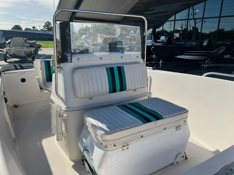 Slide: The Image of 1993 Pro-Line 170 Sportsman boat interior with striped seating. - 8