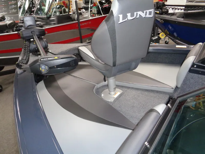 Slide: The Image of 2024 Lund 1775 Crossover XS features list with stainless propeller, battery charger, and GPS system. - 19