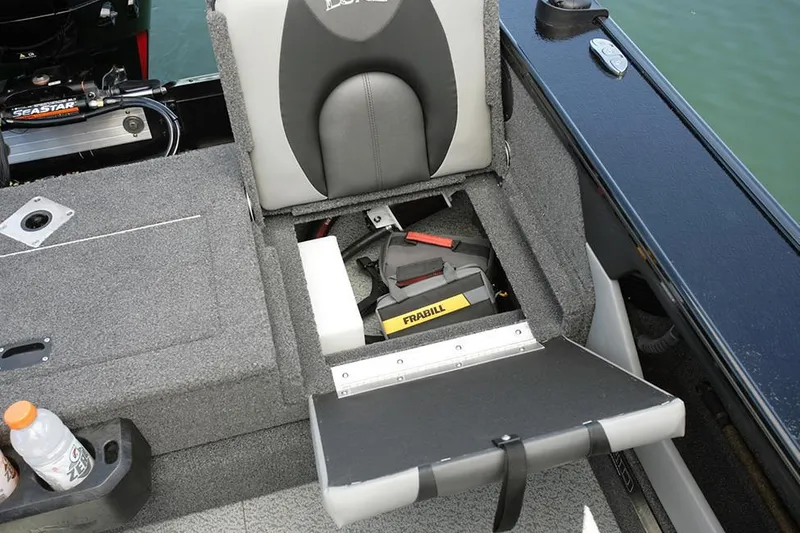 Slide: The Image of 2024 Lund 1775 Crossover XS boat interior with seating and trolling motor. - 23
