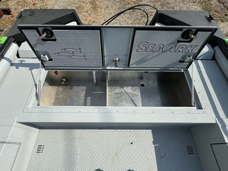 Slide: The Image of 2024 SeaArk ProCat 200 boat storage compartment with open lid. - 11