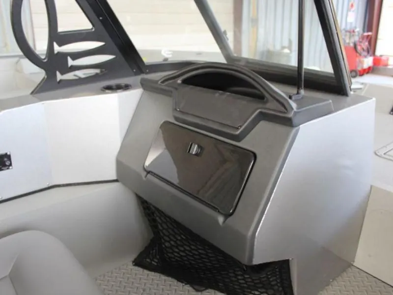 Slide: The Image of 2024 SeaArk ProCat 200 boat interior console with storage compartment. - 15