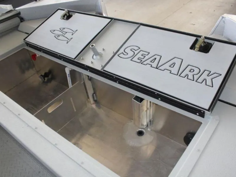 Slide: The Image of 2024 SeaArk ProCat 200 boat storage compartment with SeaArk branding. - 17