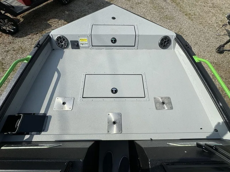 Slide: The Image of 2024 SeaArk ProCat 200 boat deck with storage compartments and speakers. - 5