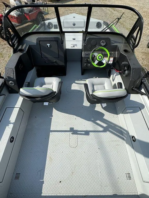 Slide: The Image of 2024 SeaArk ProCat 200 boat interior with dual seats and steering console. - 8