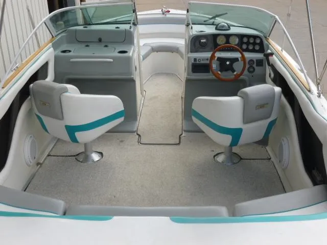 Slide: The Image of 1992 Tiara Sport 250 boat interior with dual seats and dashboard controls. - 12