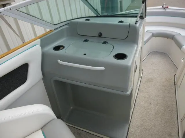Slide: The Image of 1992 Tiara Sport 250 boat interior with seating and storage compartments. - 15