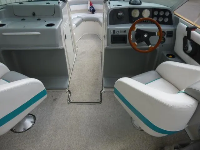 Slide: The Image of Interior of a 1992 Tiara Sport 250 boat with steering wheel and seating. - 28