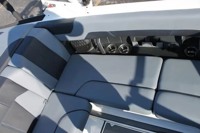 Slide: The Image of 2024 Malibu 20 VTX boat interior with sleek gray seating and modern design. - 10